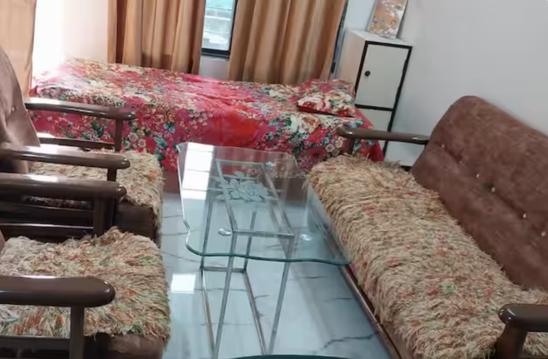 Bright living area with sofas and bed at AG House, Daman